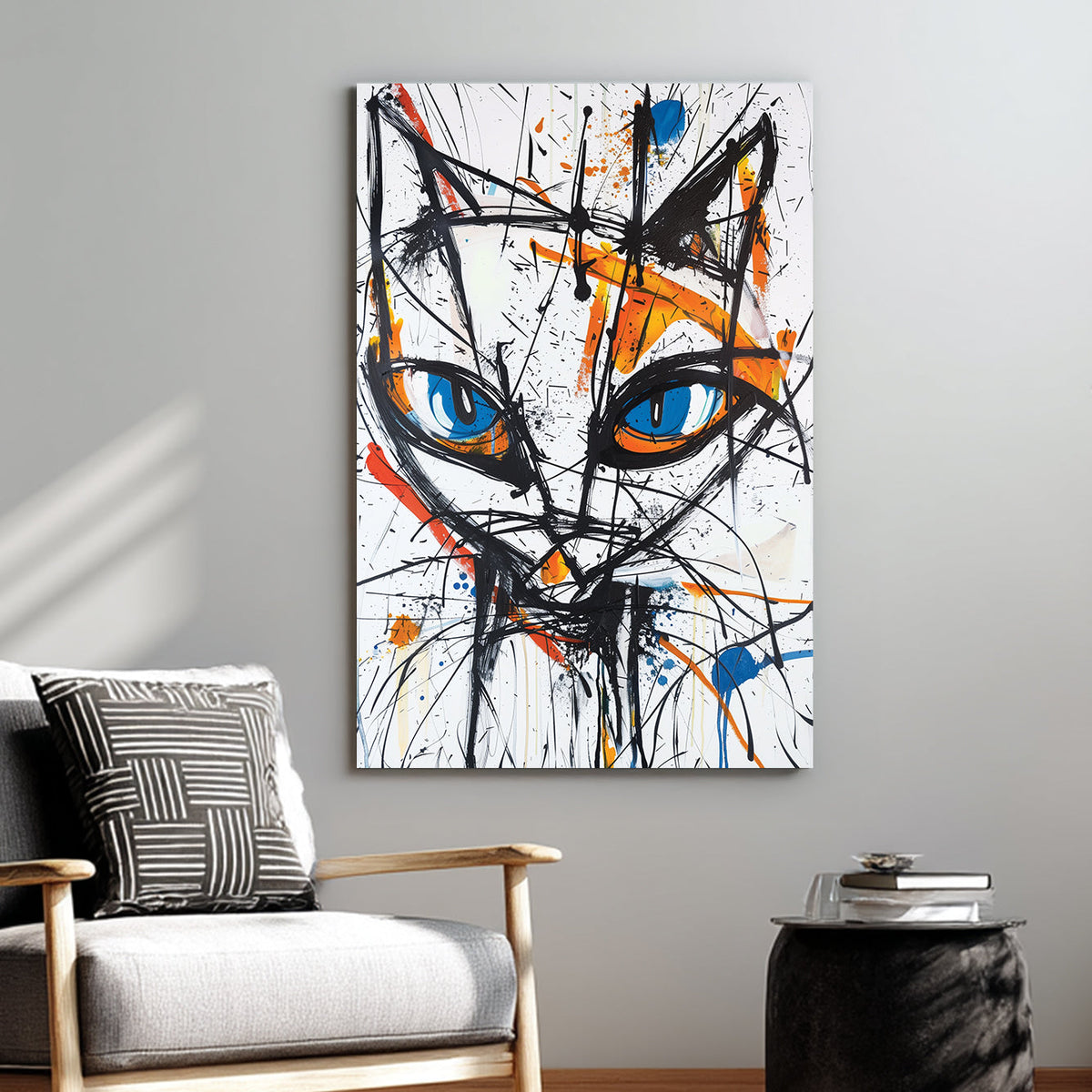 Wall art featuring abstract cat face with blue eyes and expressive paint splashes