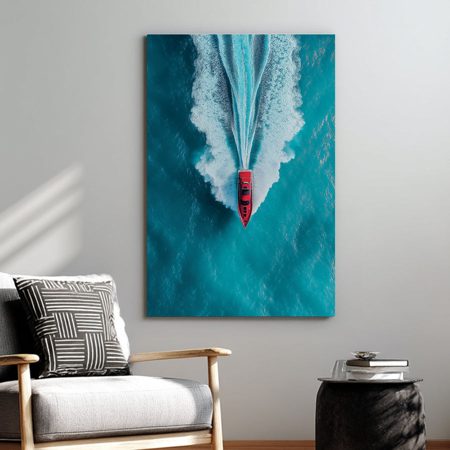 Aerial wall art of red boat speeding across turquoise ocean