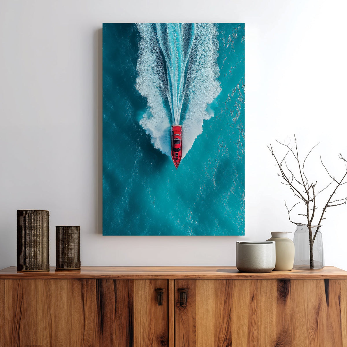Aerial wall art of red boat speeding across turquoise ocean
