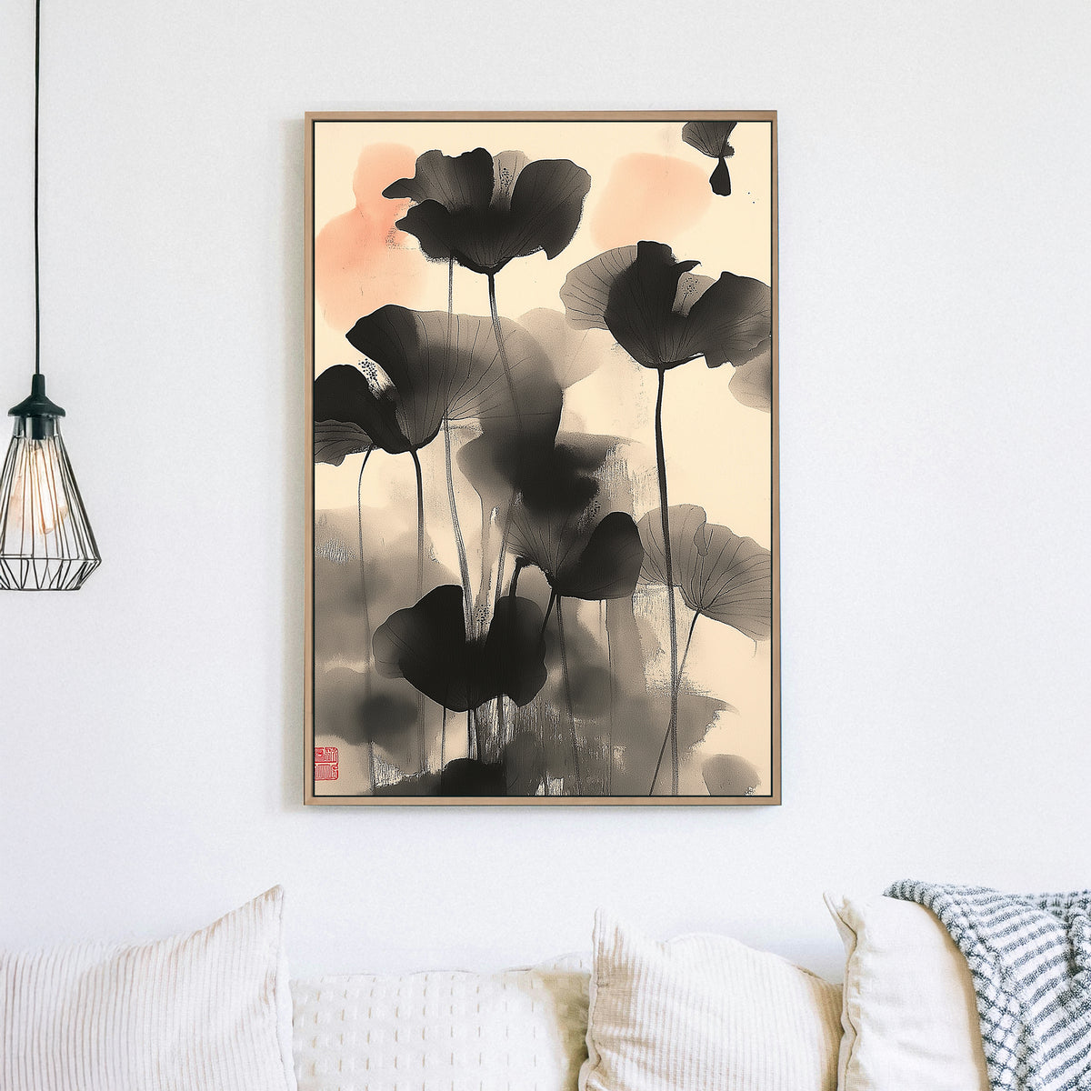 Wall art of abstract black lotus flowers in Japanese ink style with soft coral accents