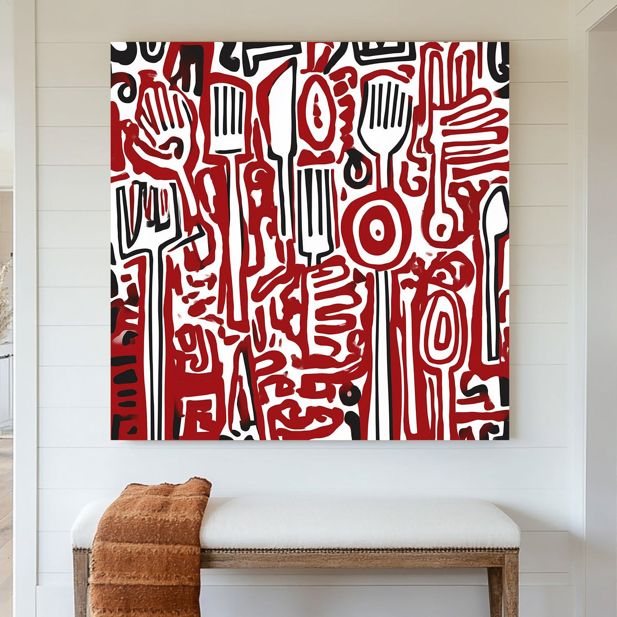 Wall art featuring abstract red and black kitchen utensils in graffiti-style pattern