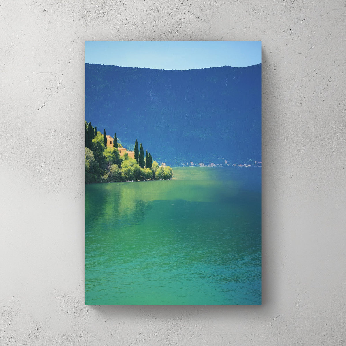 Wall art of a tranquil lakeside village surrounded by hills and still water