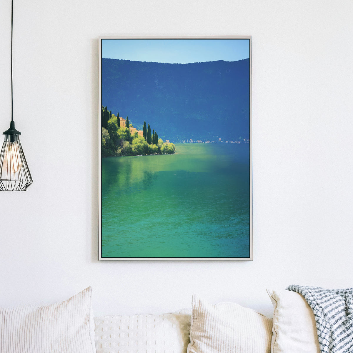 Wall art of a tranquil lakeside village surrounded by hills and still water