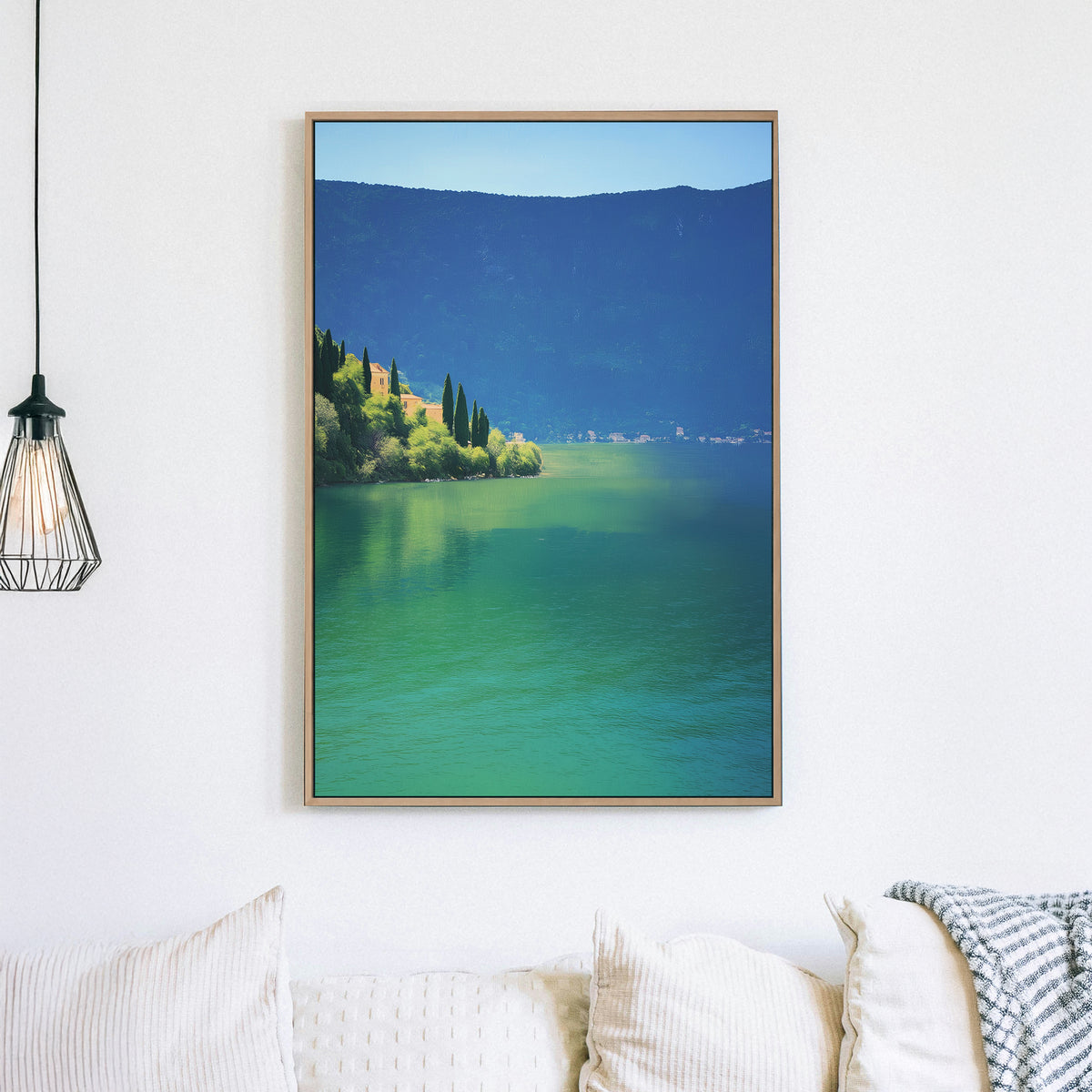 Wall art of a tranquil lakeside village surrounded by hills and still water