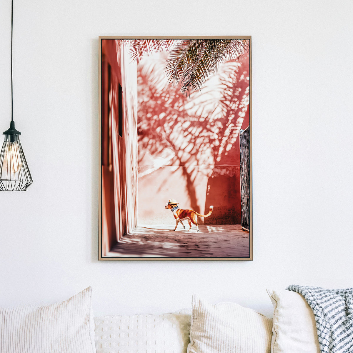 Stylish dog wearing a hat walking through a sunlit alley with palm shadows on pink walls