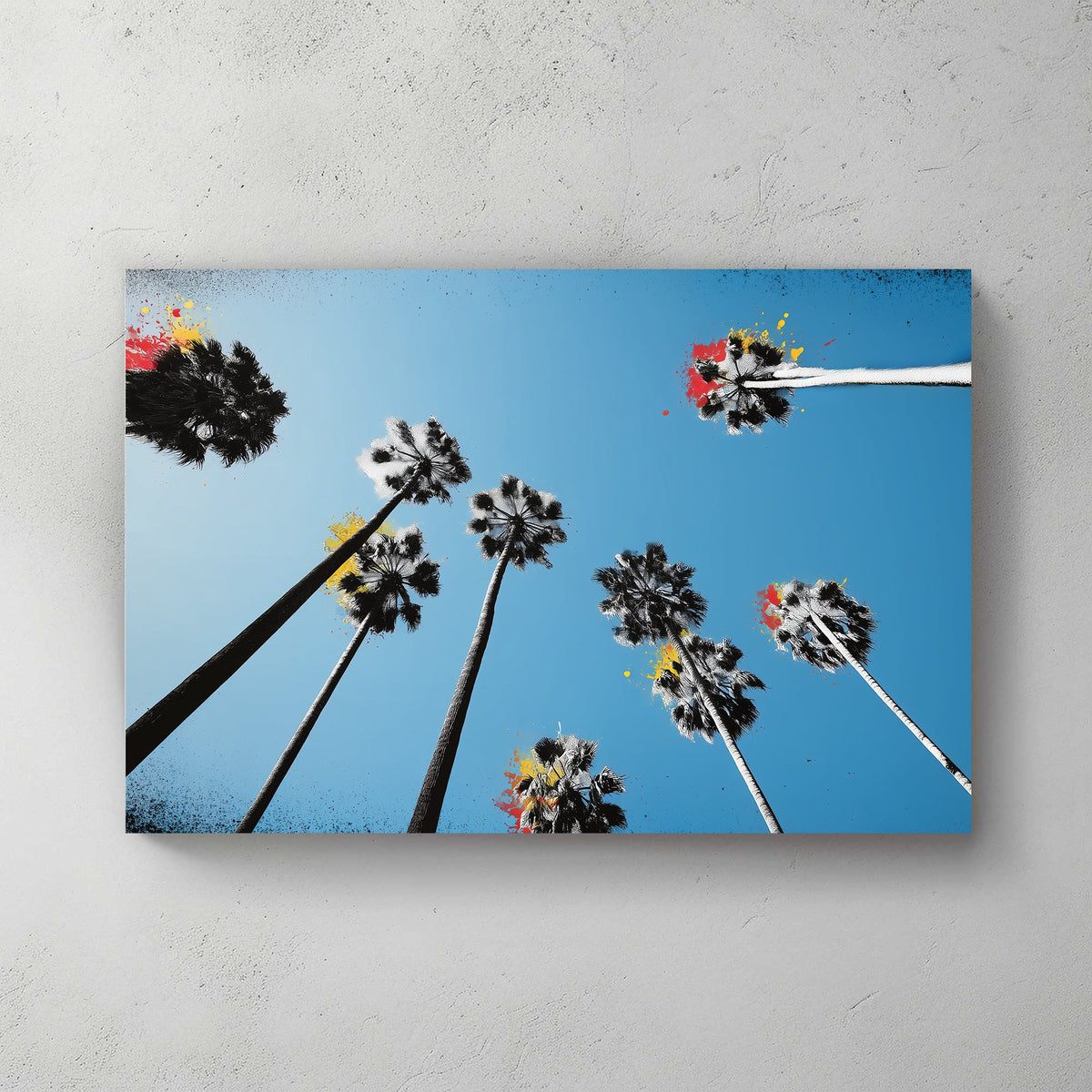graffiti palm trees wall art with blue sky and paint splashes