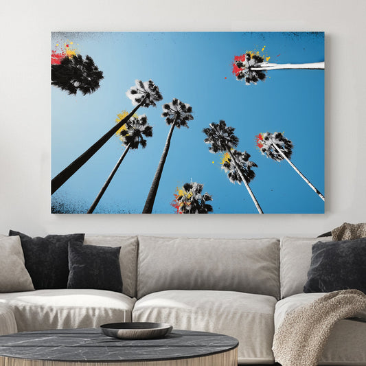 graffiti palm trees wall art with blue sky and paint splashes
