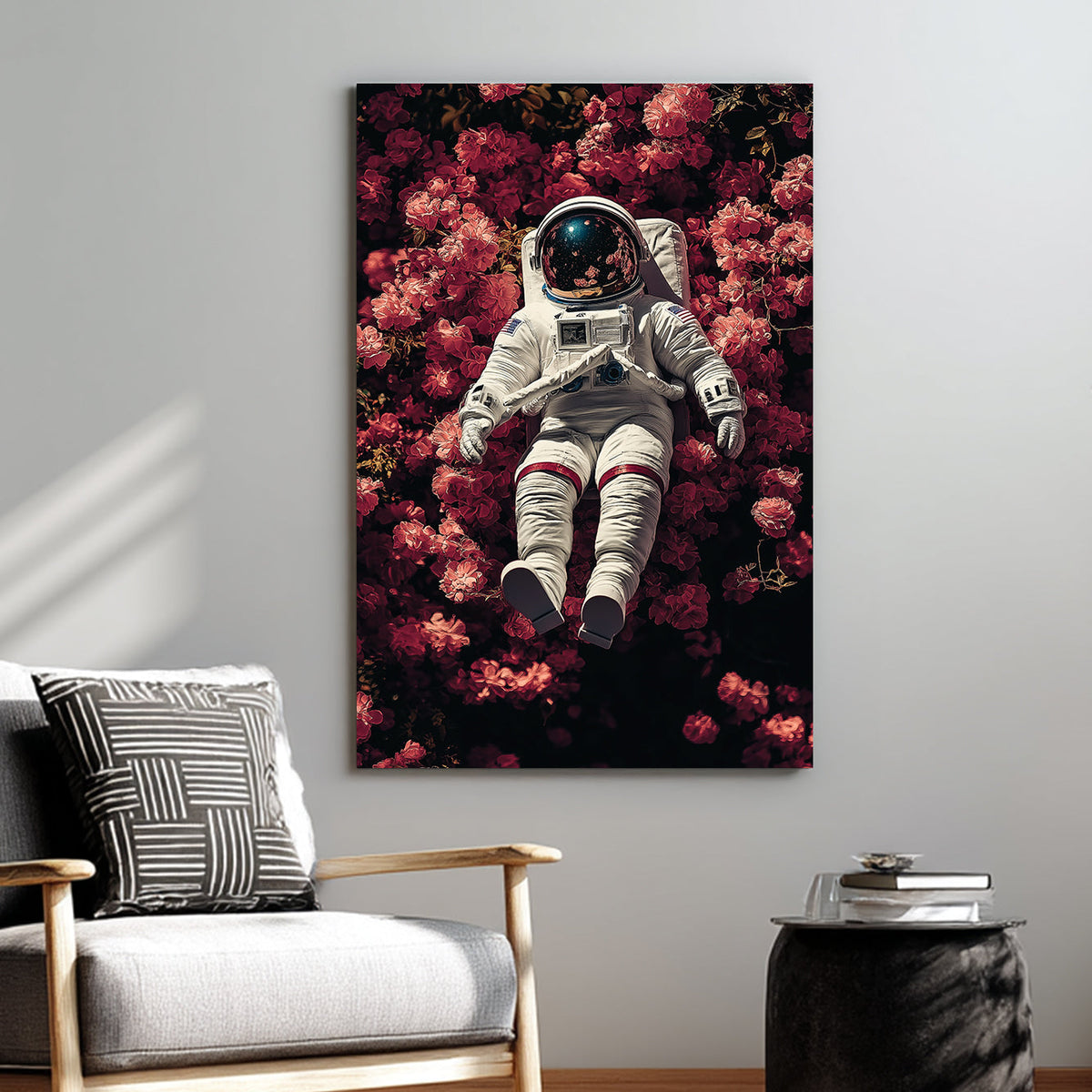 wall art of astronaut resting in a field of pink flowers with galaxy reflection in helmet