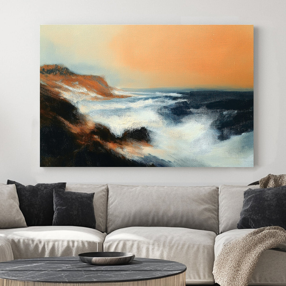 wall art of dramatic ocean waves crashing into rocky cliffs beneath a peach-orange sky