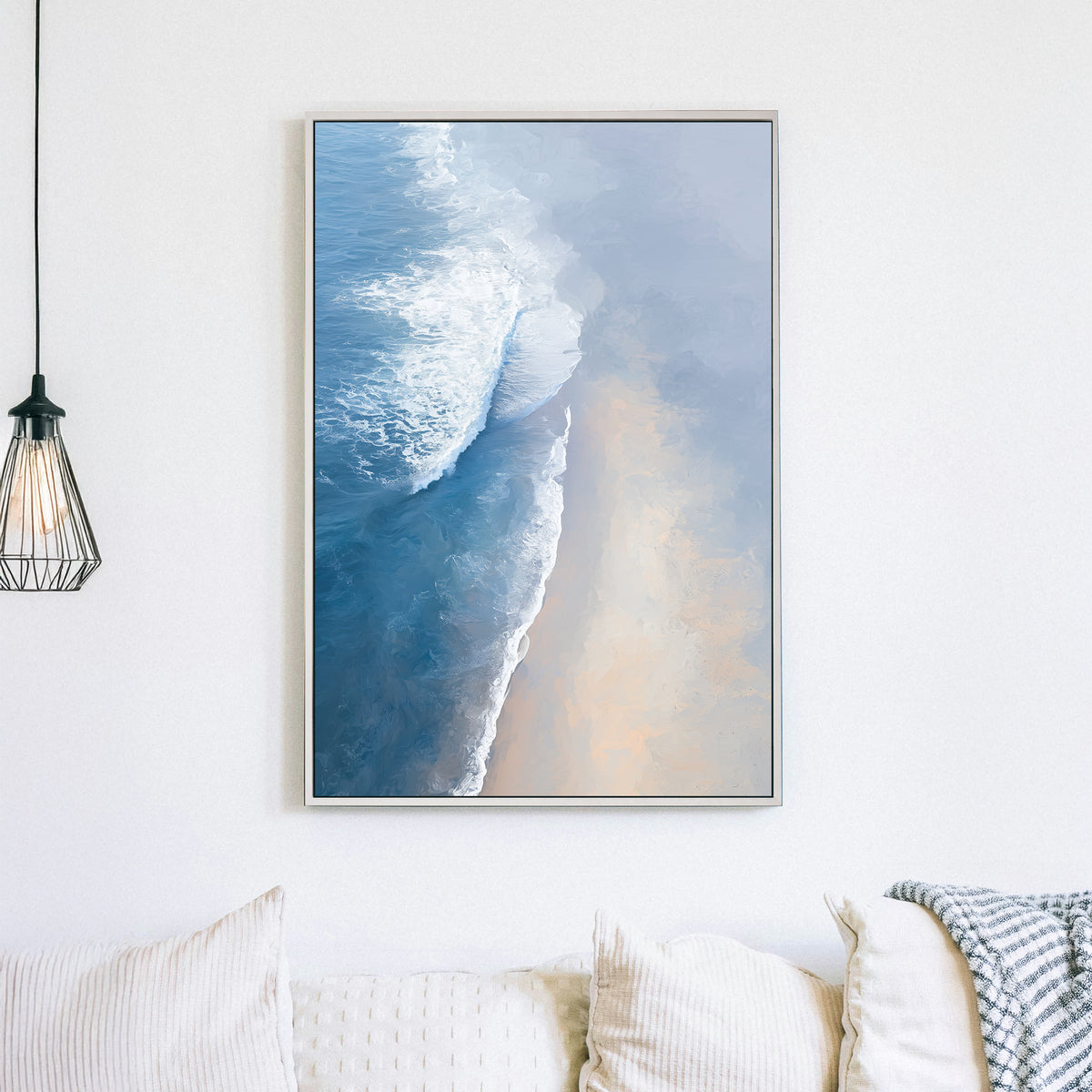 aerial painting of soft ocean waves meeting a sandy beach
