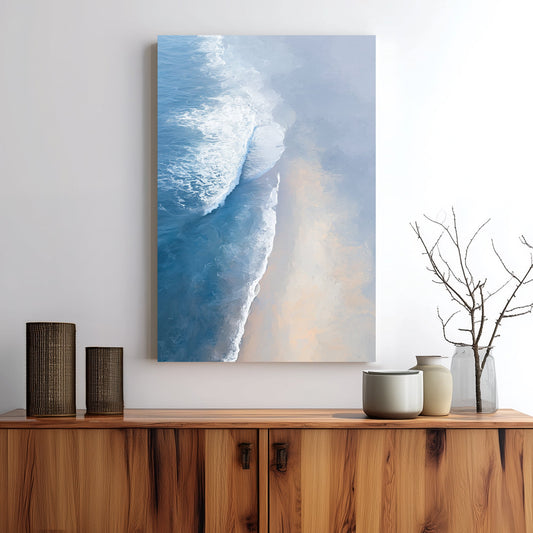 aerial painting of soft ocean waves meeting a sandy beach