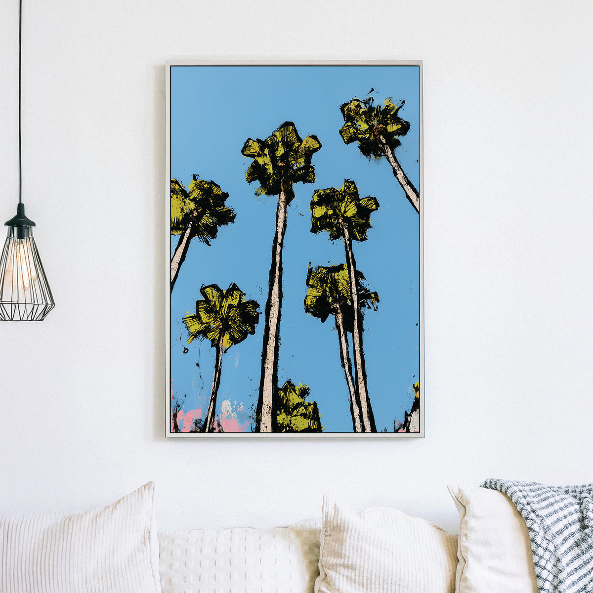 graphic palm tree wall art with bright blue sky