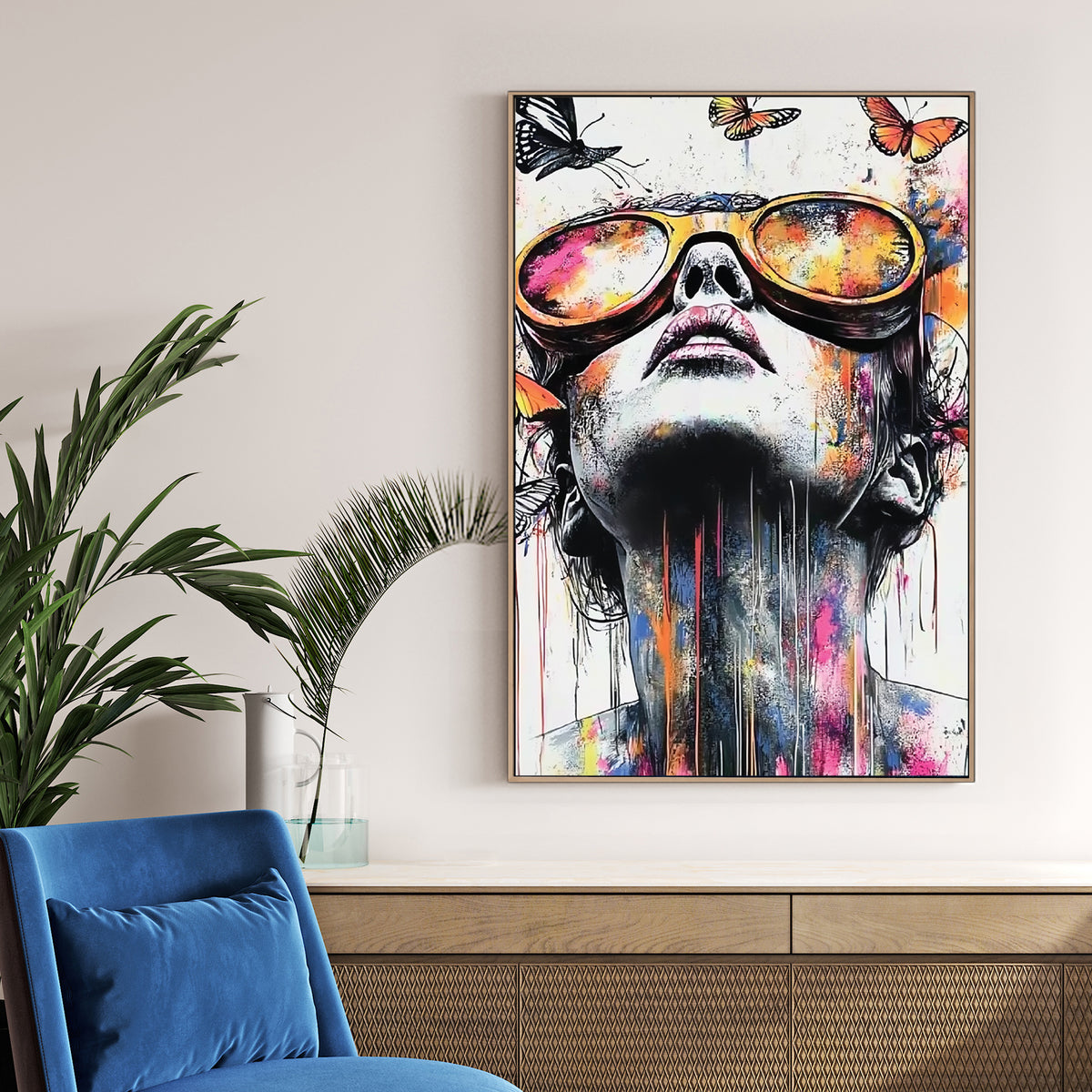 colourful portrait of woman in sunglasses with butterflies and paint splashes wall art