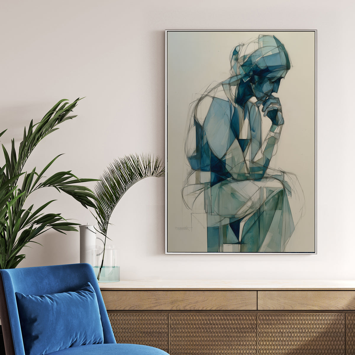 blue geometric figure wall art of person in deep thought