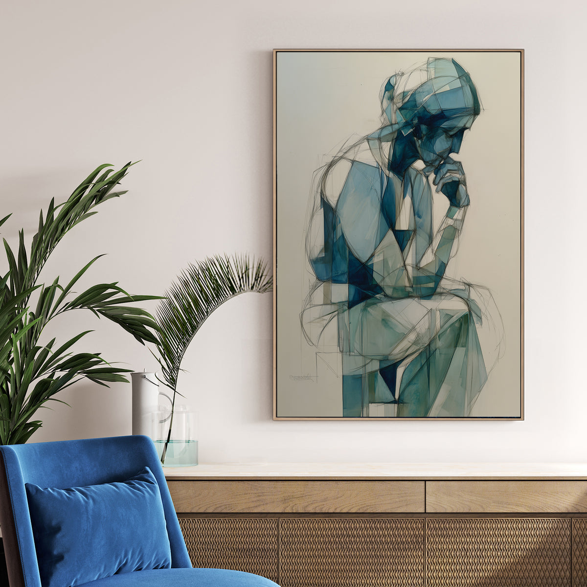 blue geometric figure wall art of person in deep thought