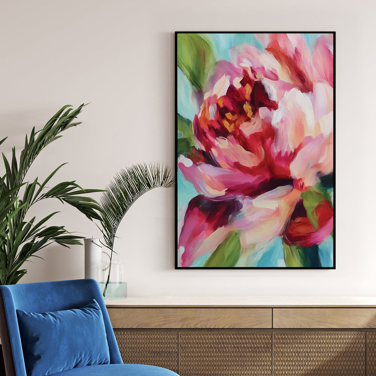 vibrant floral wall art with abstract pink and red petals on blue background