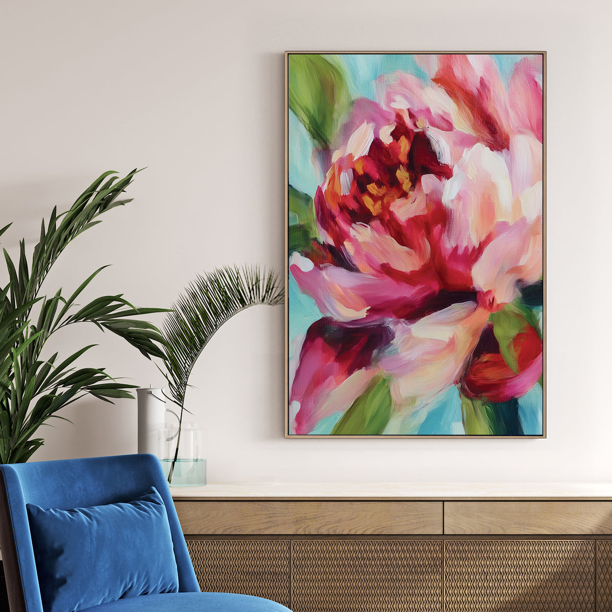 vibrant floral wall art with abstract pink and red petals on blue background