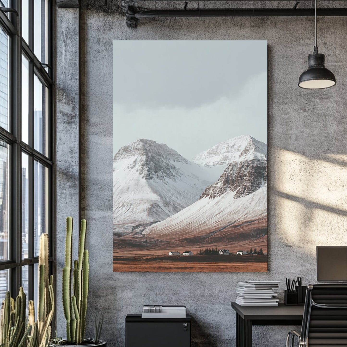 Snowy mountain landscape with cabins on a golden plain beneath grey skies