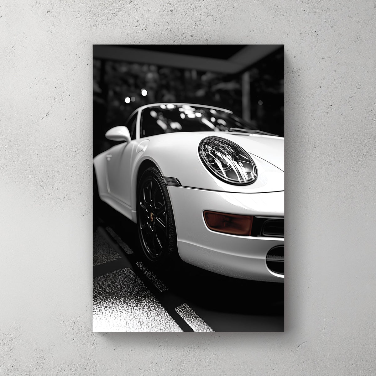 black and white Porsche wall art with dramatic showroom lighting