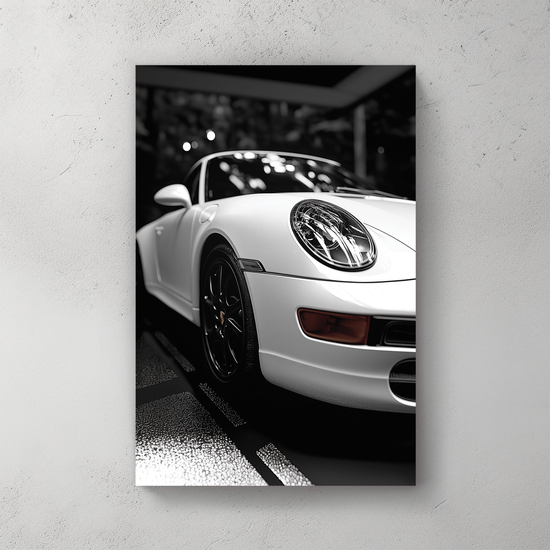 black and white Porsche wall art with dramatic showroom lighting