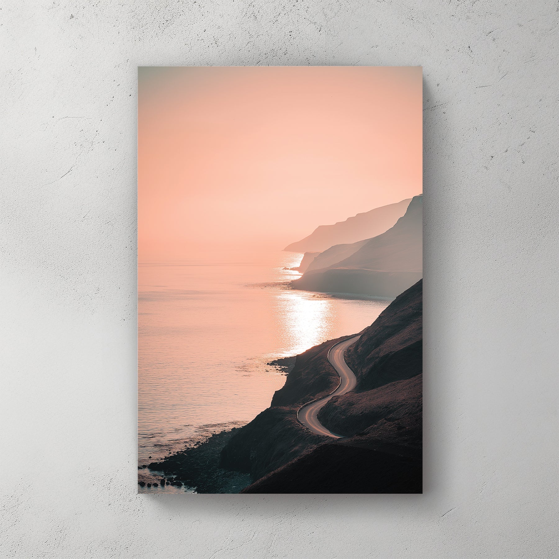coastal road winding along ocean cliffs at sunset