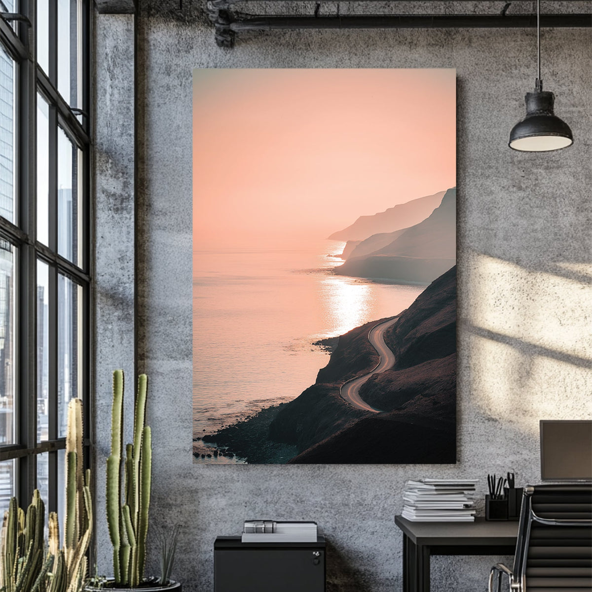 coastal road winding along ocean cliffs at sunset