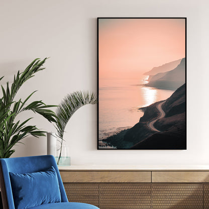 coastal road winding along ocean cliffs at sunset