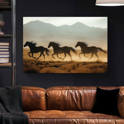 three horses running in desert with mountain background wall art