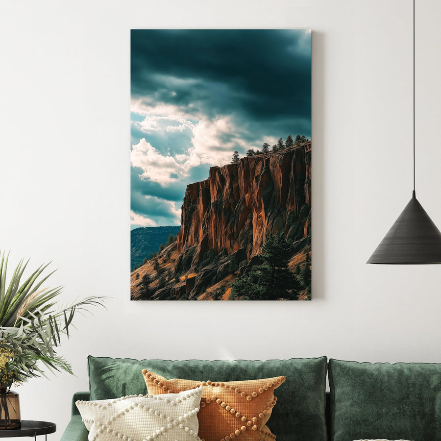 dramatic cliffside landscape with dark storm clouds and sunlit orange rock formations