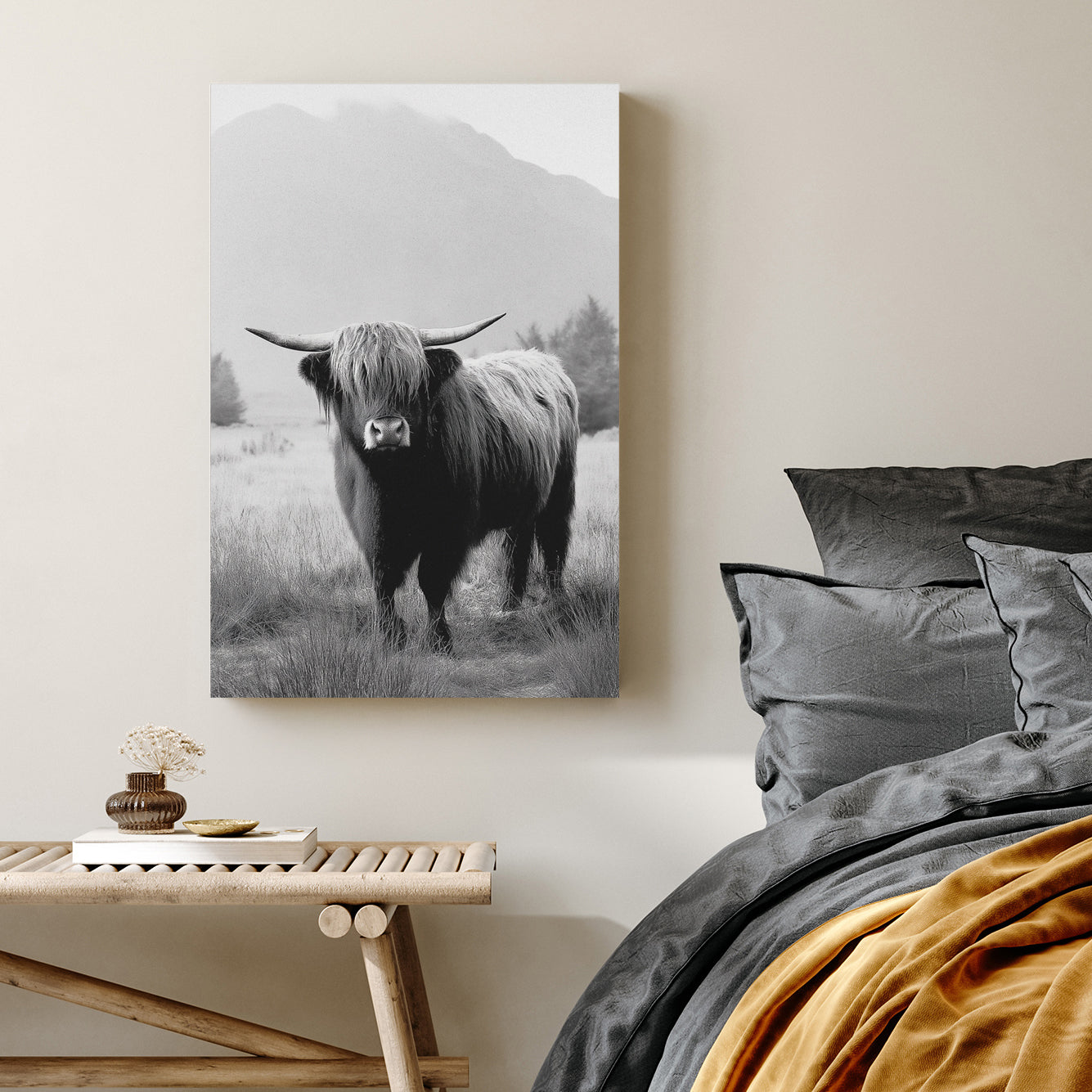 black and white highland cow photograph in front of misty mountain