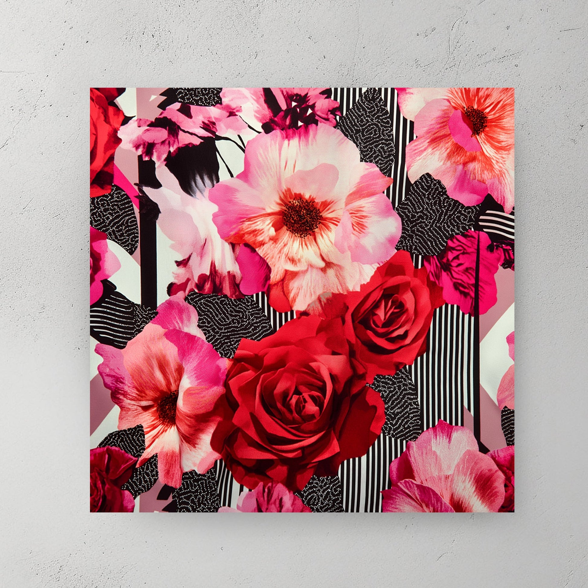 modern floral wall art with red roses and pink hibiscus on graphic background