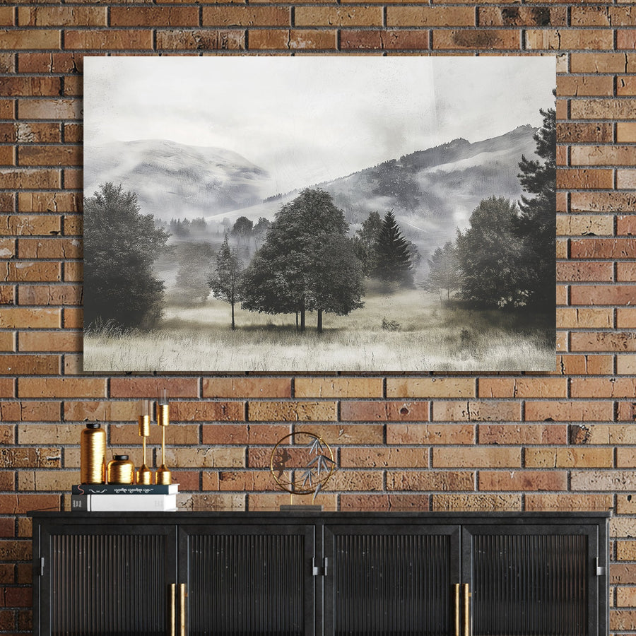 black and white landscape of foggy trees and distant hills in open meadow