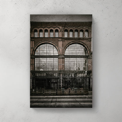 vintage photo of Army and Navy Store building with arched brick windows and old film texture