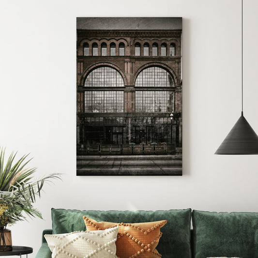 vintage photo of Army and Navy Store building with arched brick windows and old film texture