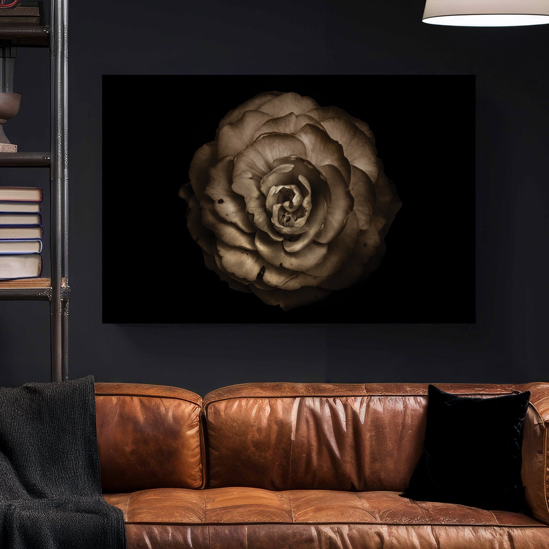 Sepia-toned close-up of a rose-like flower with curled petals on black background