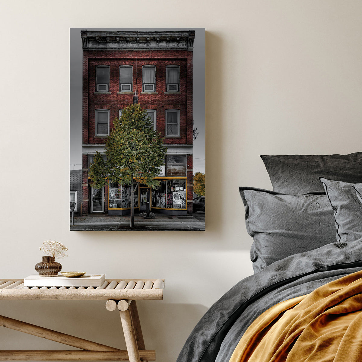 Vintage red-brick storefront with urban posters and single tree, moody sky backdrop