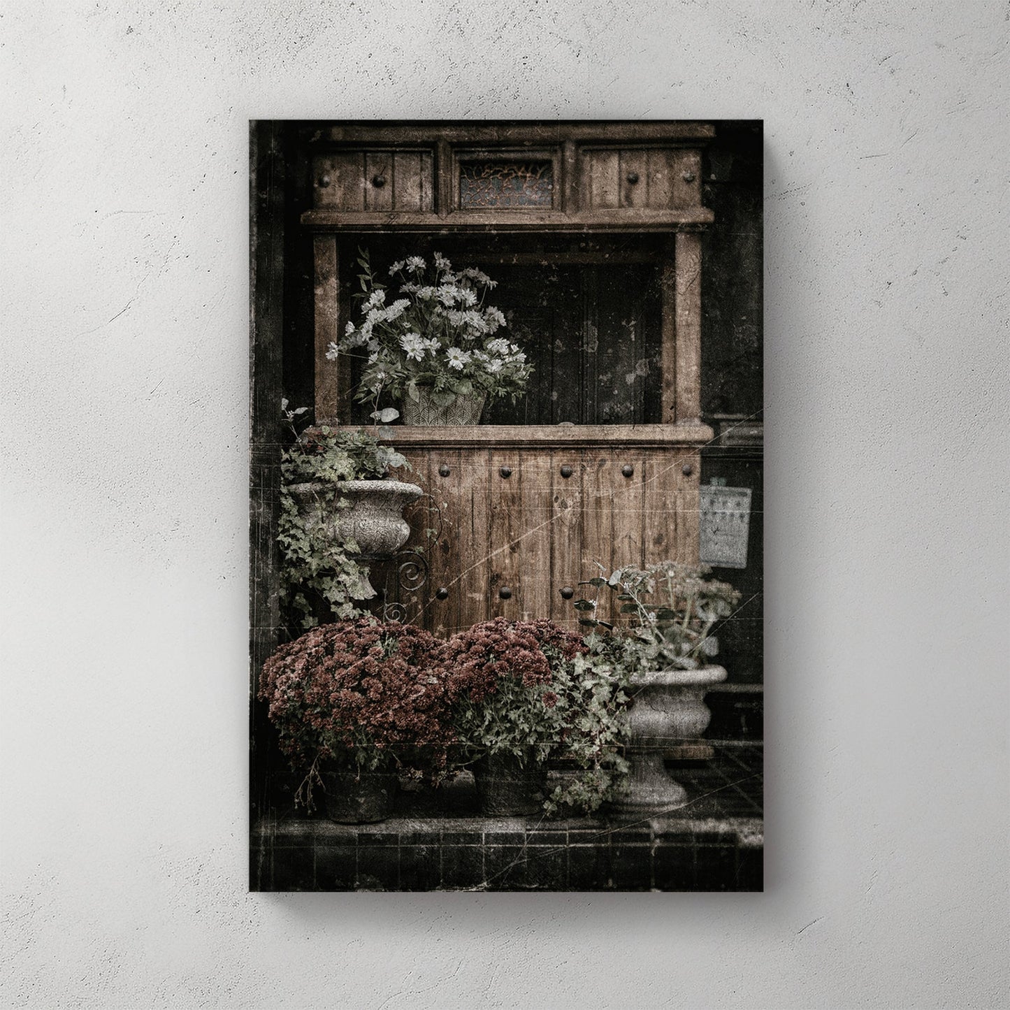 vintage buffet with flowers and rustic texture wall art