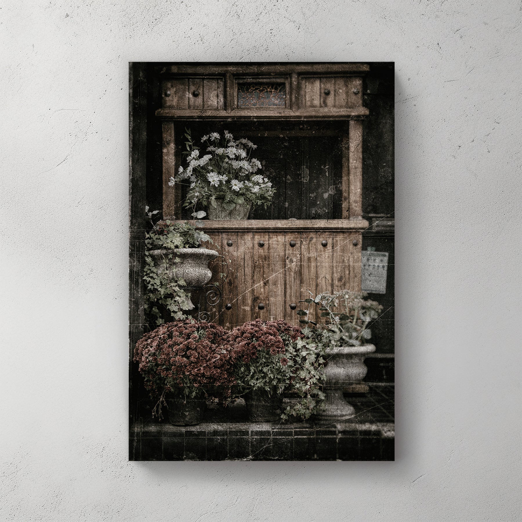 vintage buffet with flowers and rustic texture wall art