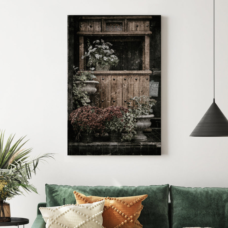 vintage buffet with flowers and rustic texture wall art