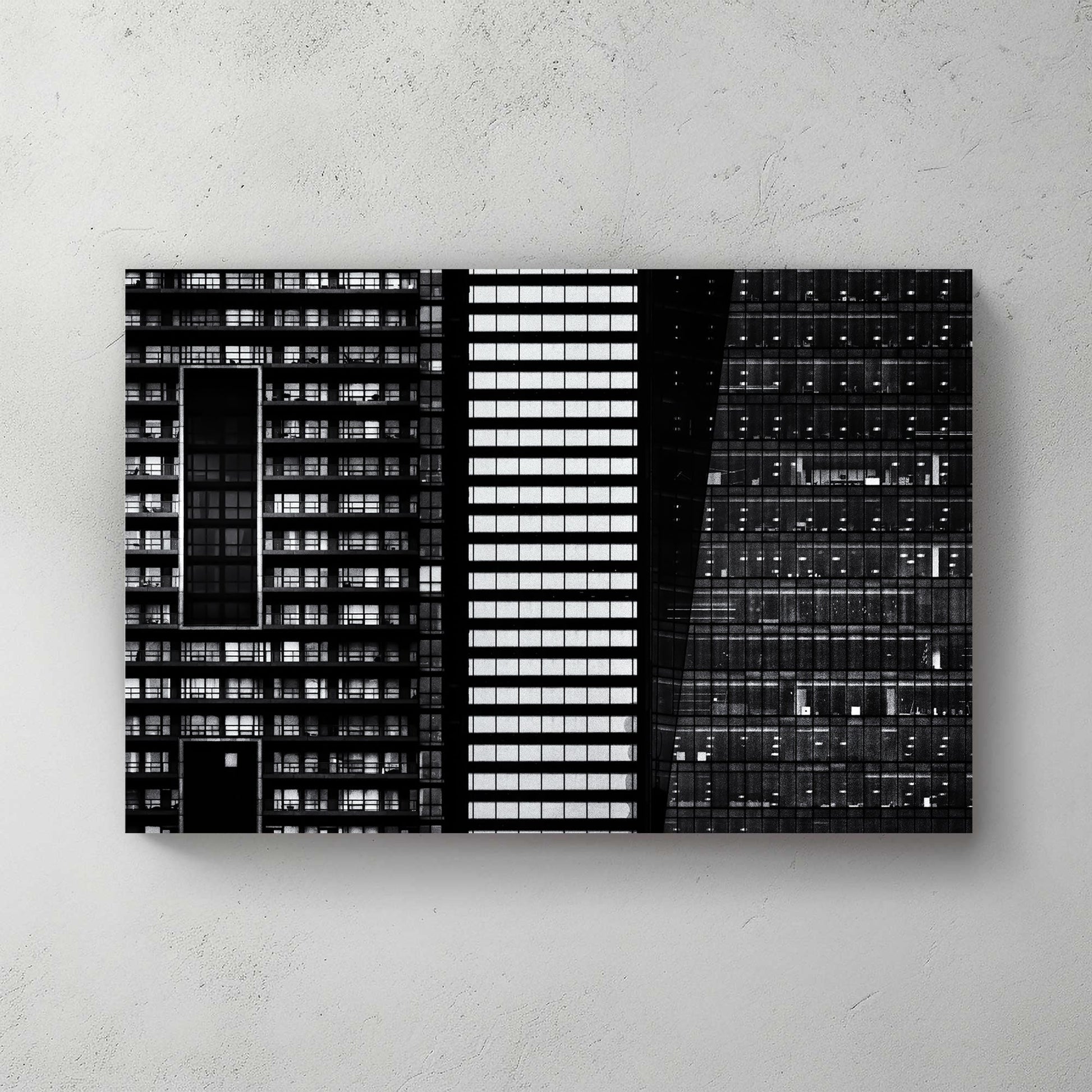 black and white closeup of modern city buildings with repeating windows and geometric patterns