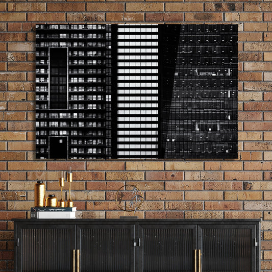black and white closeup of modern city buildings with repeating windows and geometric patterns