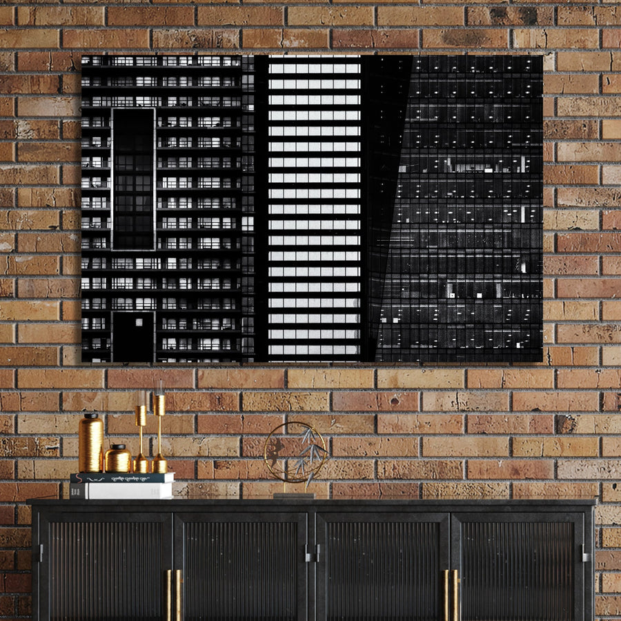 black and white closeup of modern city buildings with repeating windows and geometric patterns