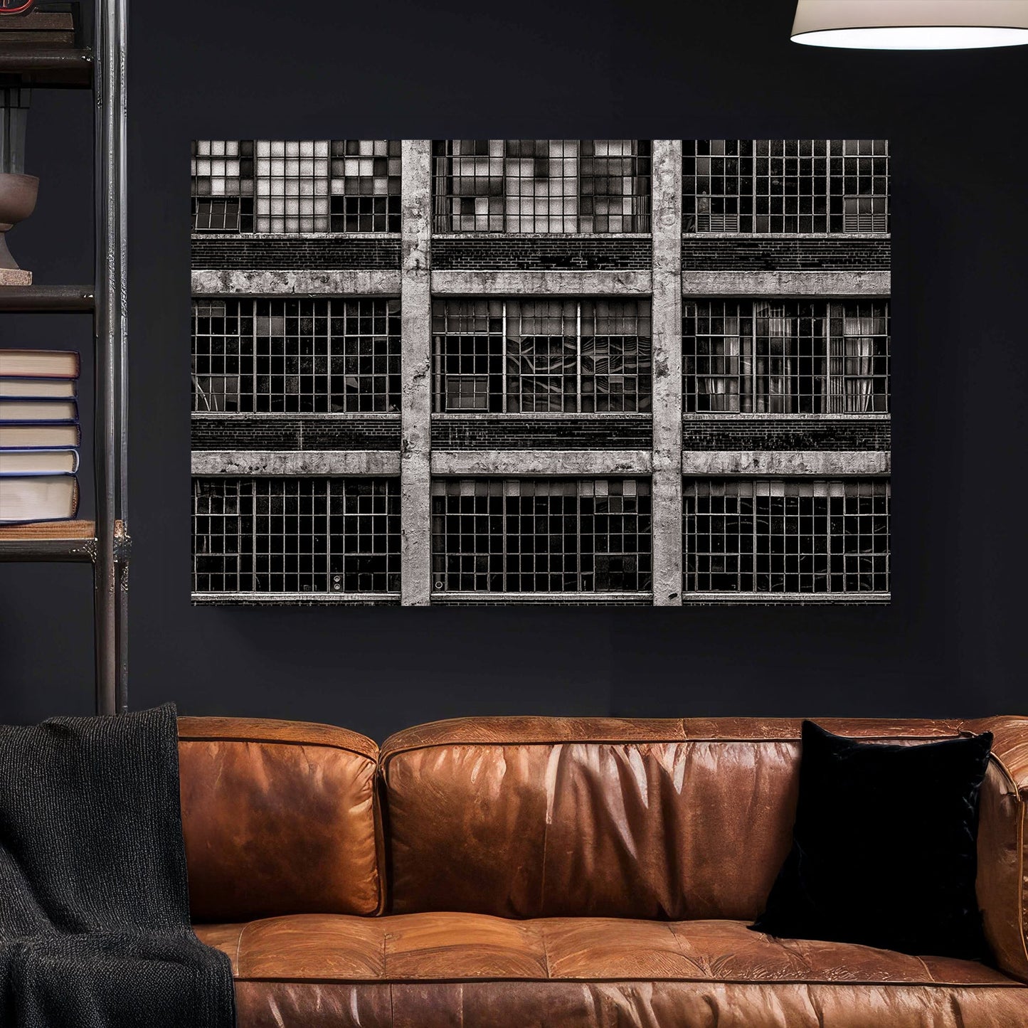 black and white industrial building with broken window panes and symmetrical grid layout