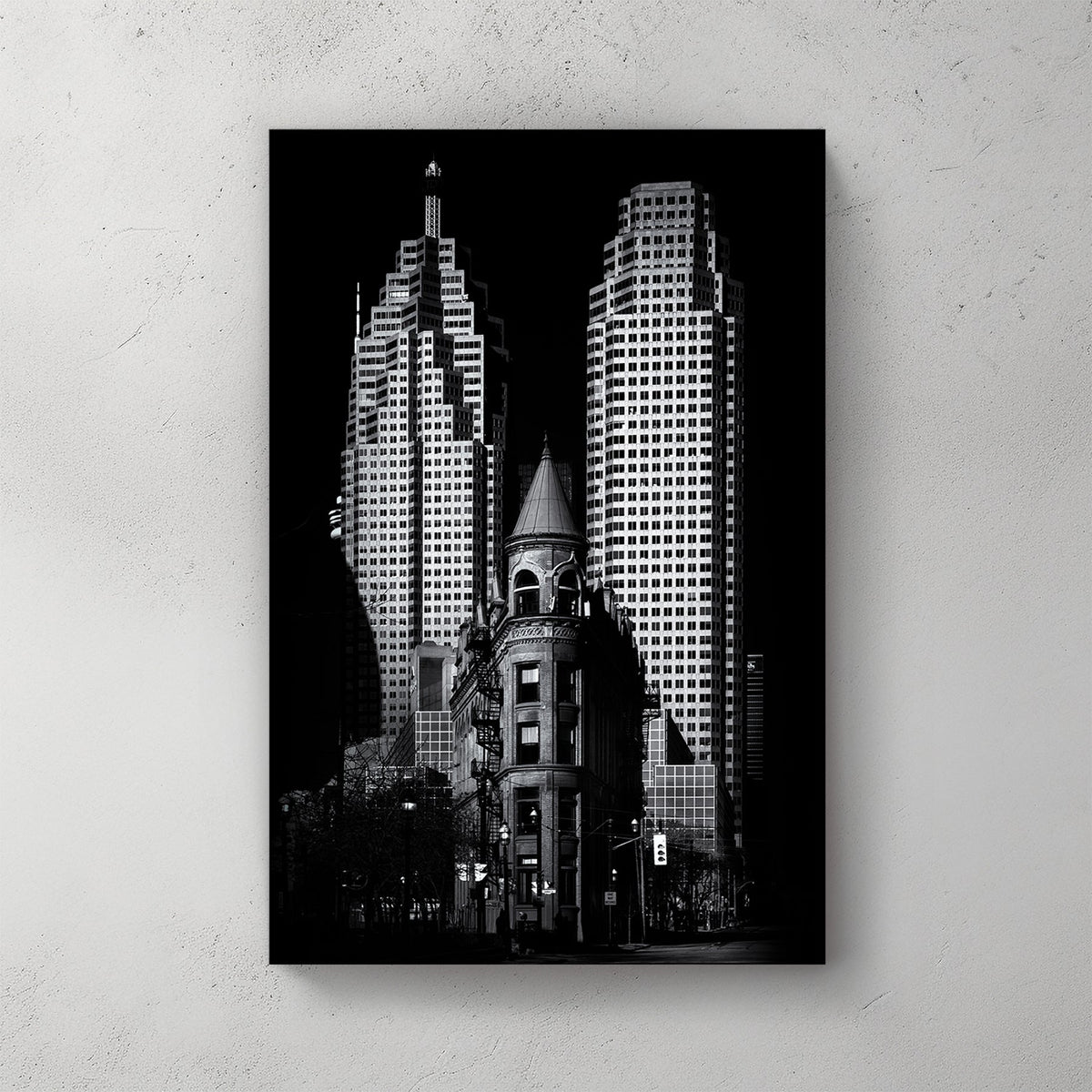 black and white image of Toronto Flatiron building with downtown skyscrapers in background