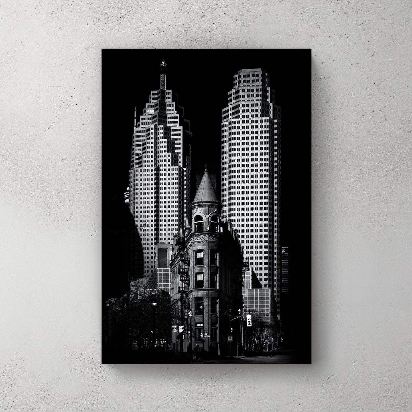 black and white image of Toronto Flatiron building with downtown skyscrapers in background