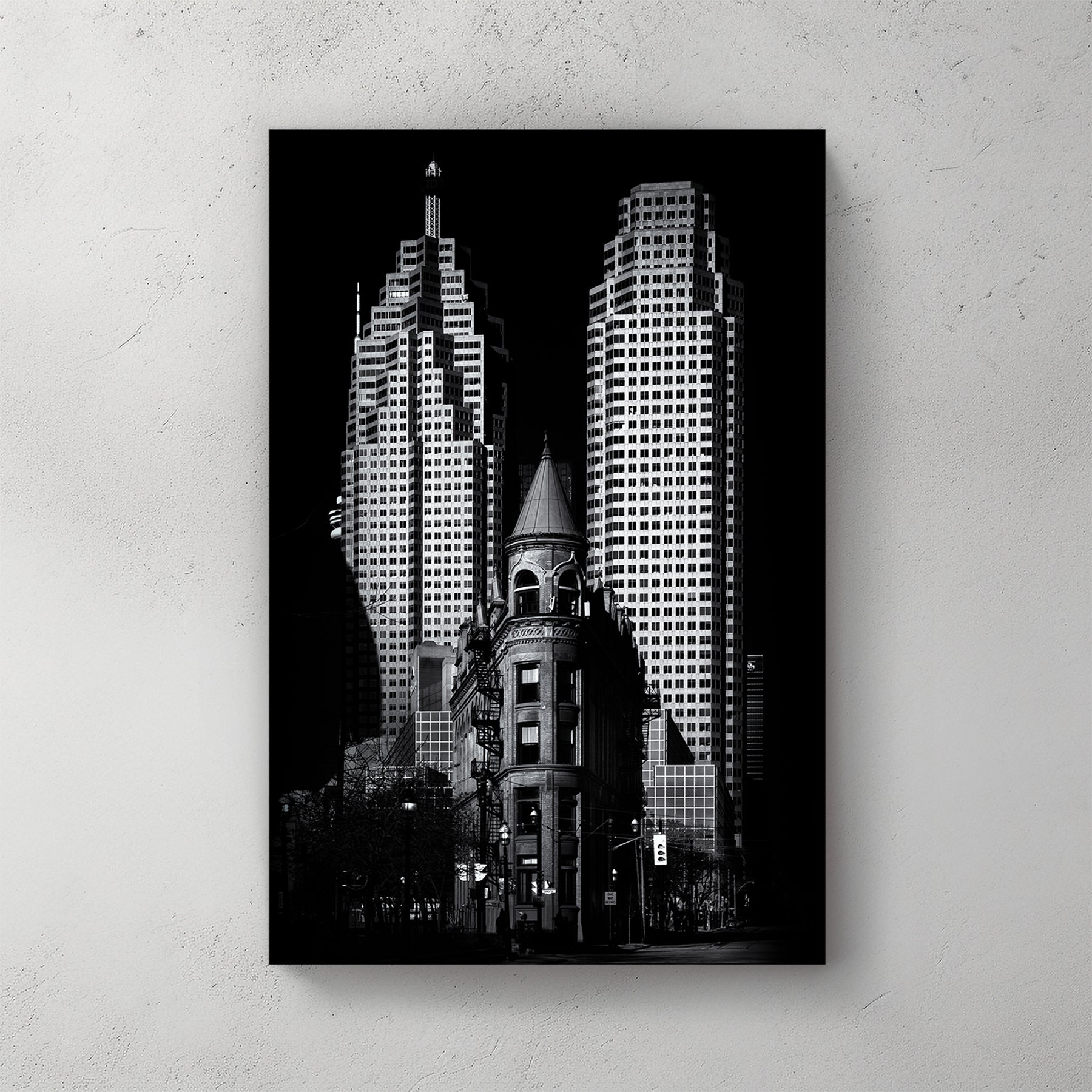 black and white image of Toronto Flatiron building with downtown skyscrapers in background