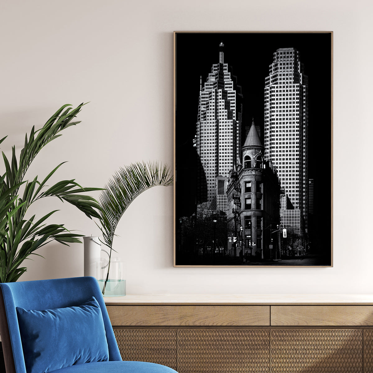 black and white image of Toronto Flatiron building with downtown skyscrapers in background