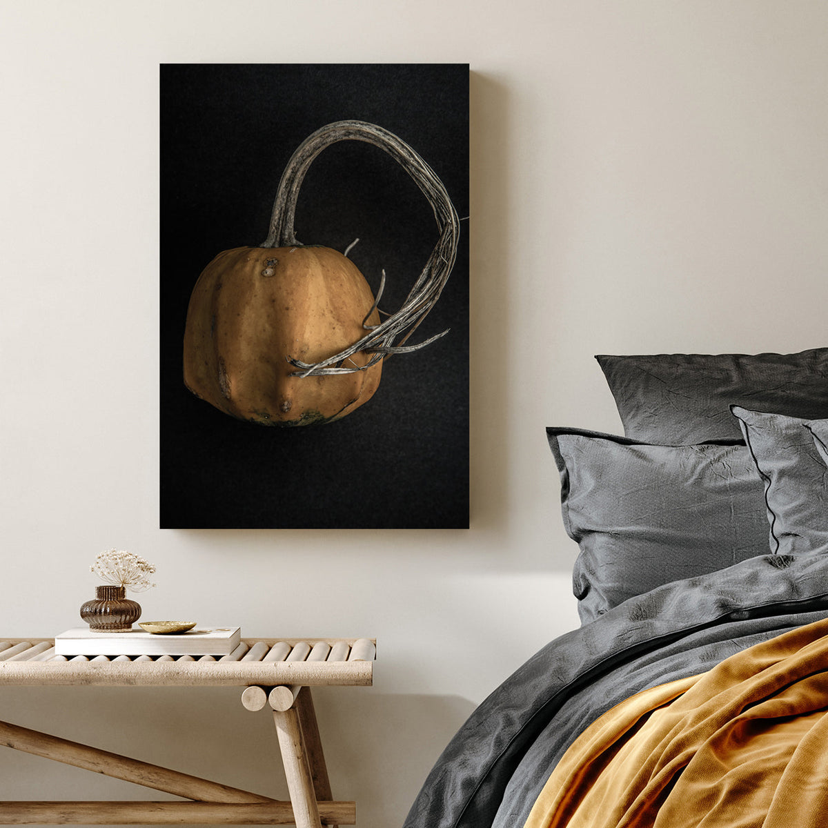 close-up of orange gourd with twisted stem on black background