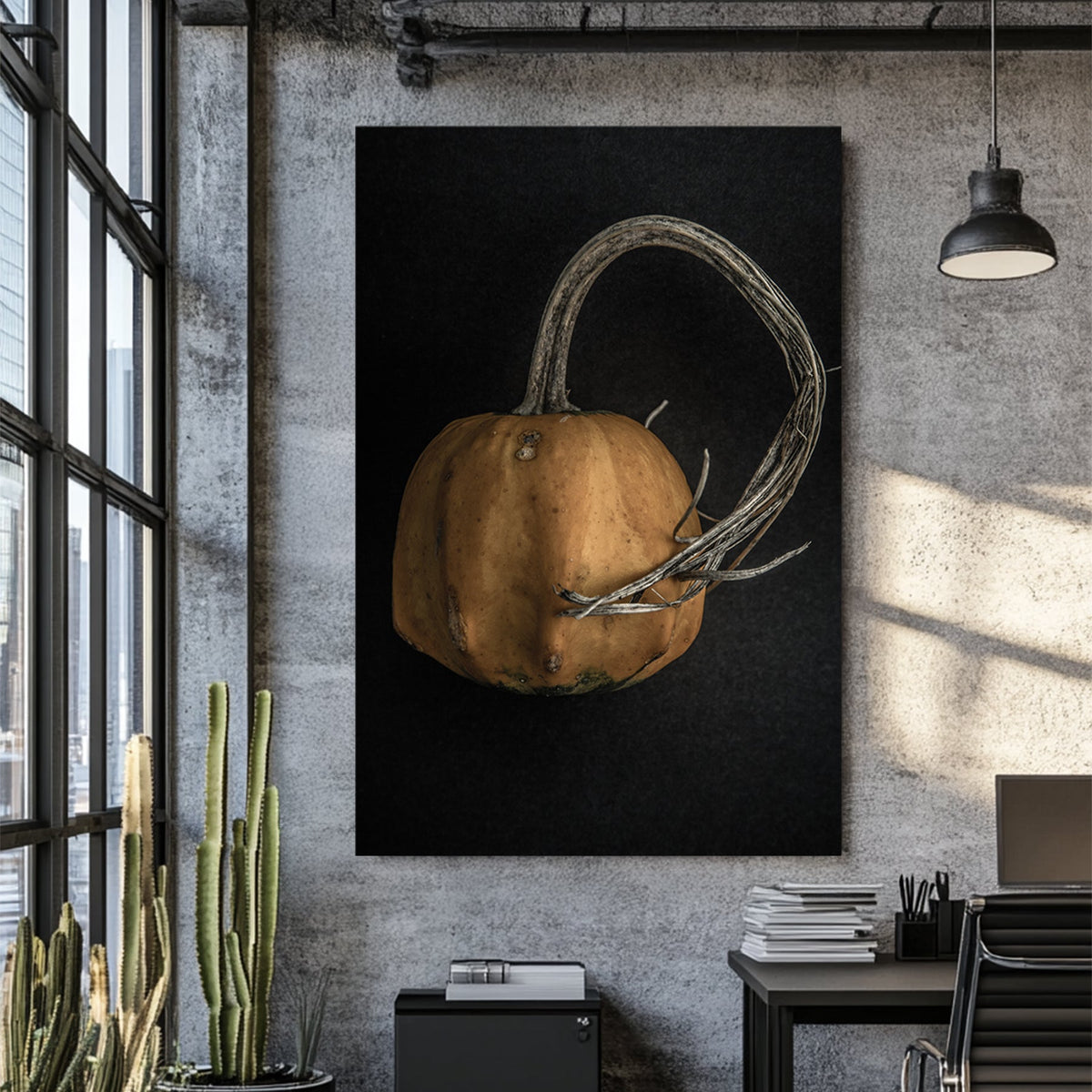 close-up of orange gourd with twisted stem on black background