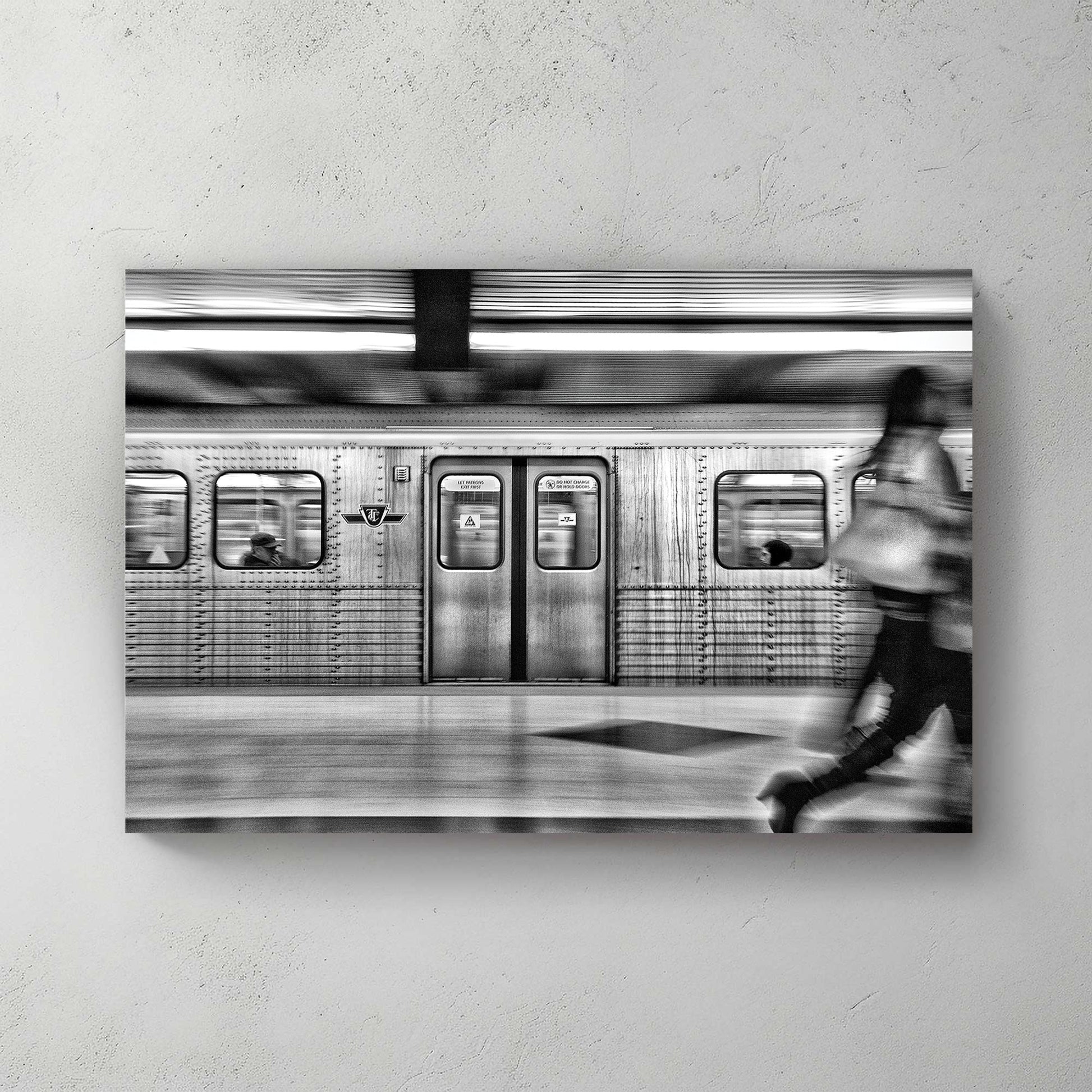 black and white TTC subway motion blur wall art in Toronto station